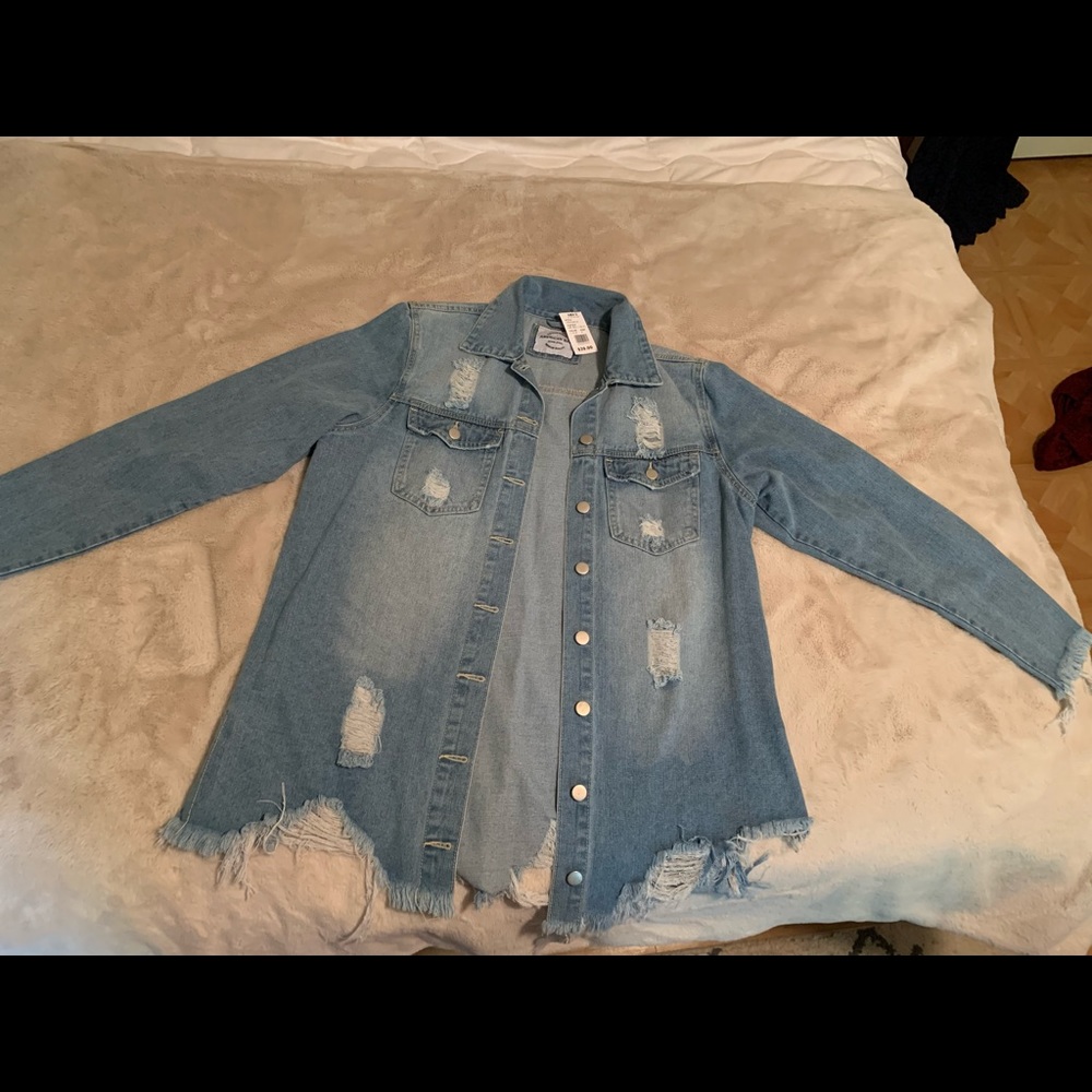 Distressed denim jacket. M